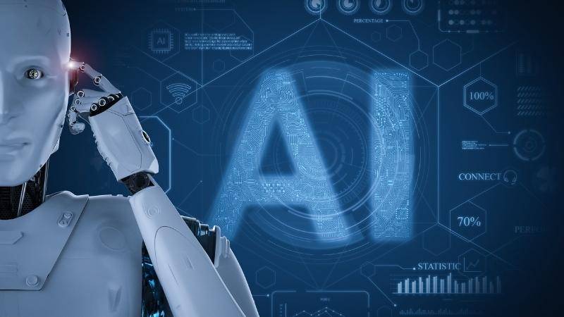 Een robot met een hand tegen het hoofd voor een blauw scherm met de letters AI en allerlei datagrafieken